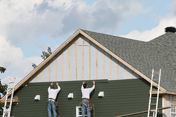 Professional Siding Replacement technician working in Rockville Centre, NY